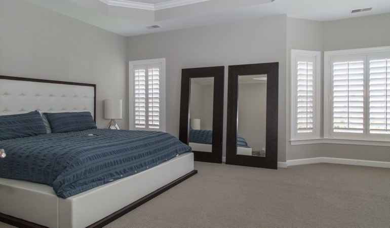 Polywood shutters in a minimalist bedroom in St. George.